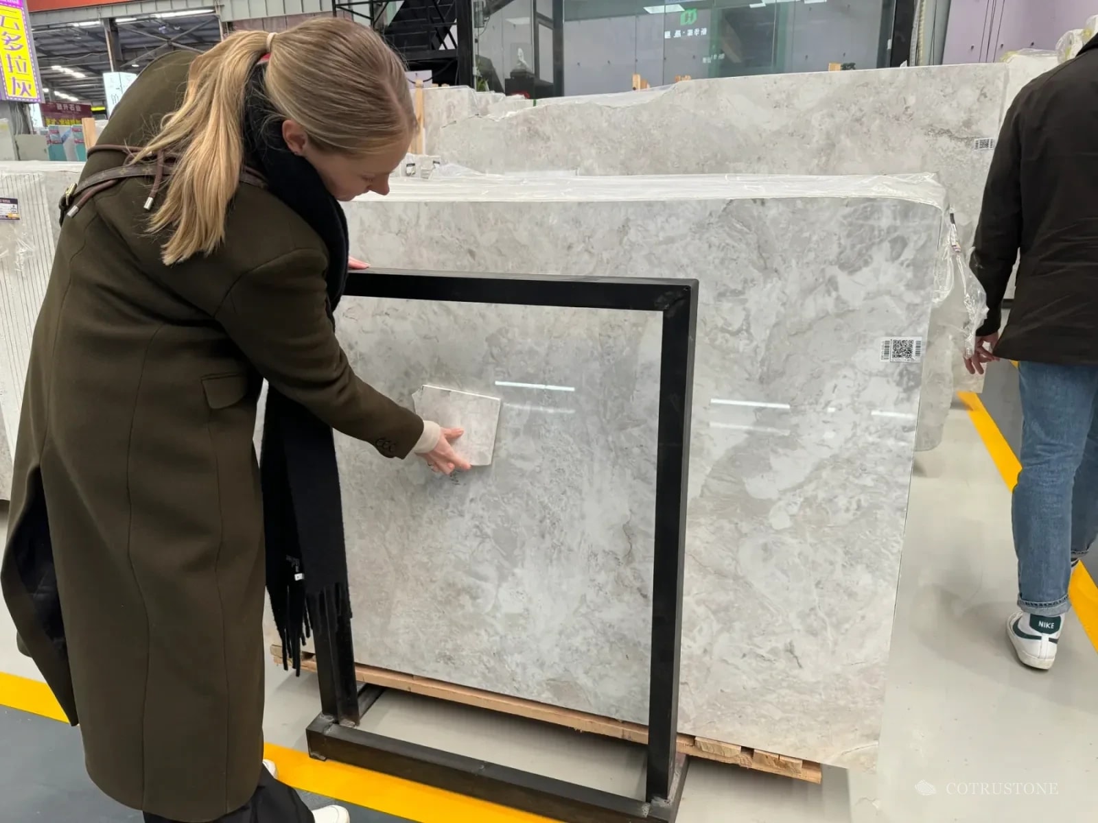 Comparing a handheld sample against larger stone pieces