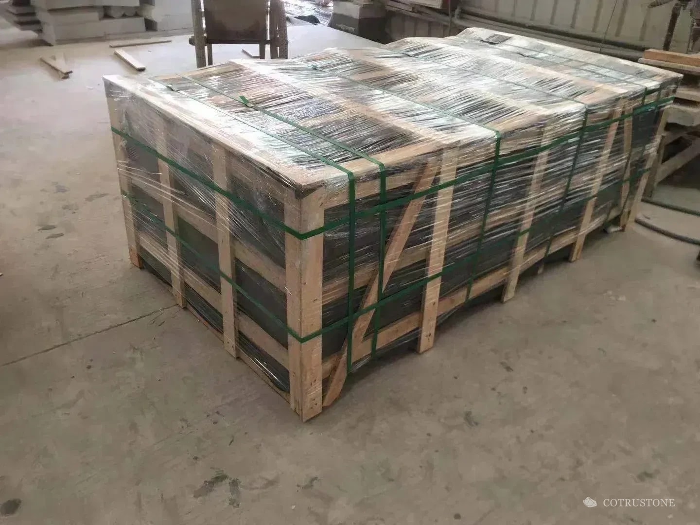 Large wrapped stone package enclosed by a timber frame