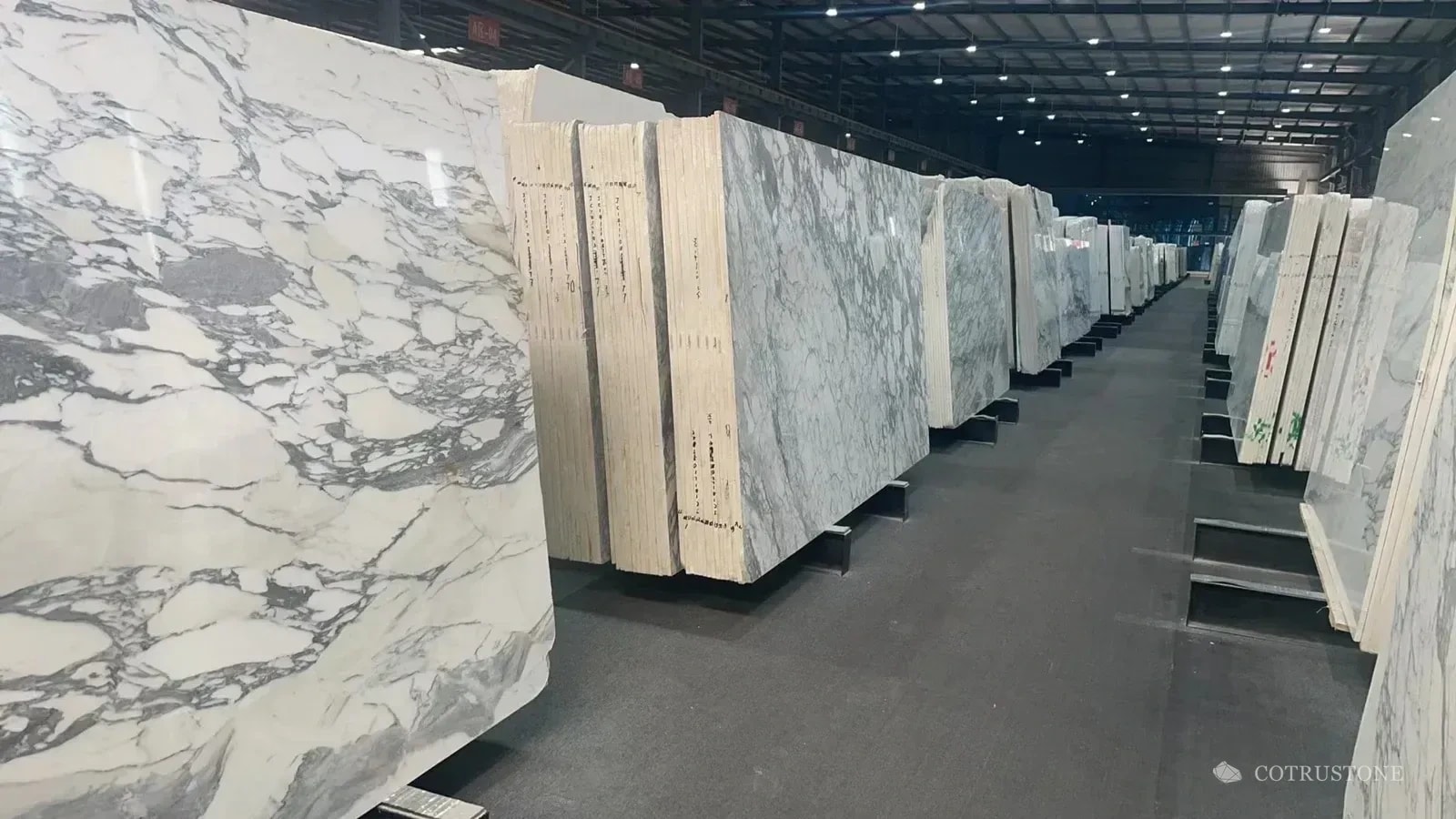Rows of marble slabs showing variation in the selection aisle