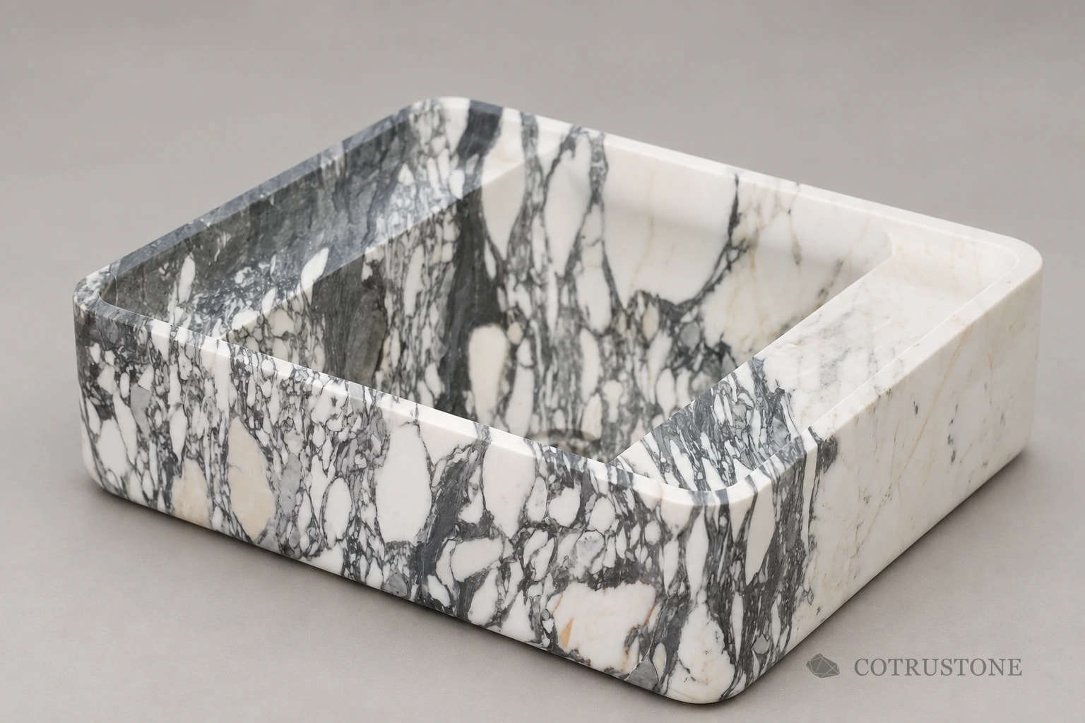 Square stone basin showing grey and white veining across the rim, outer face and bowl