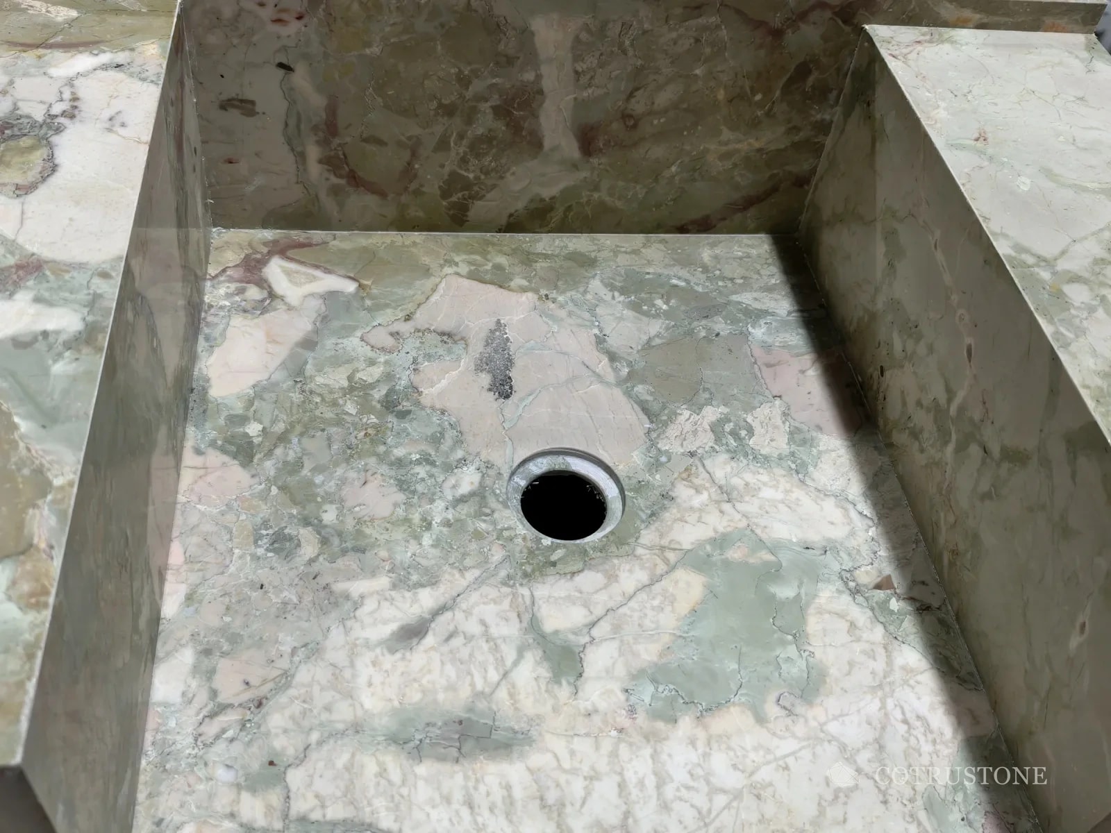 Monet Garden marble across the basin floor, inner walls and adjoining deck