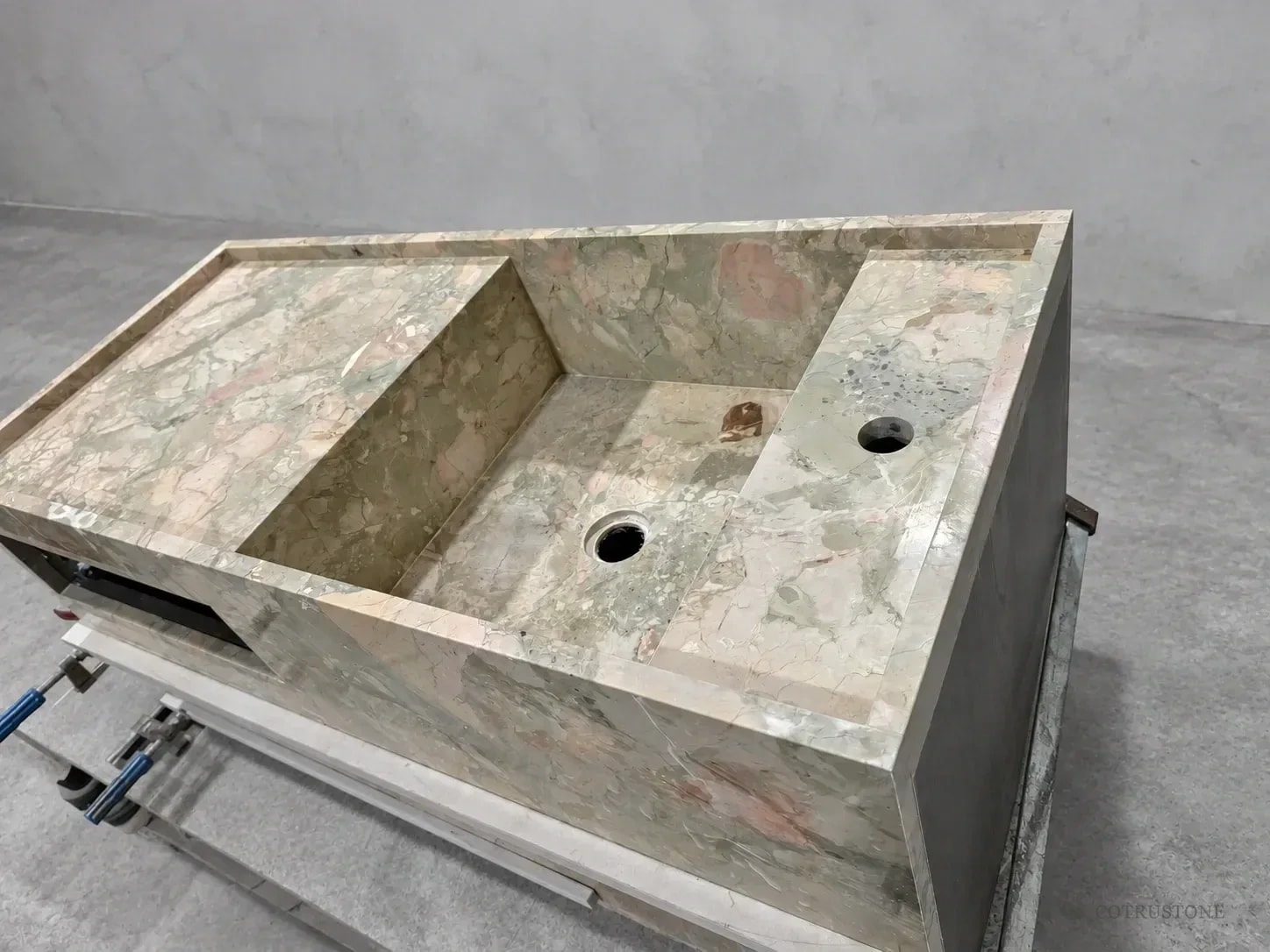 Monet Garden marble vanity with integrated basin and full-height stone body