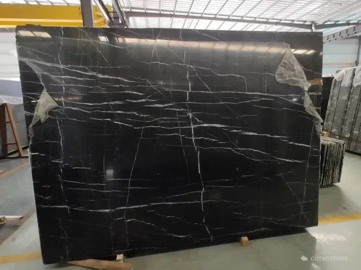 Complete Nero Marquina Marble slab with white veins crossing a black ground