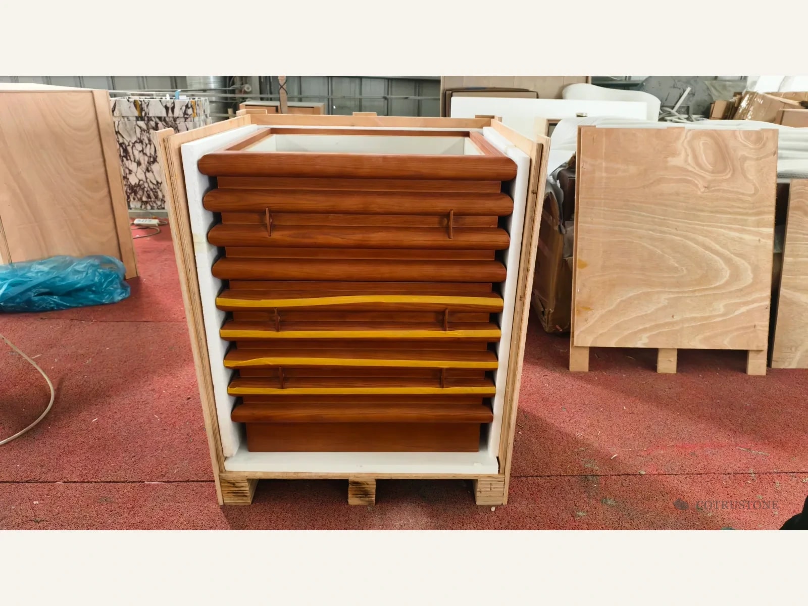 Wooden cabinet body inside an open lined timber shipping case