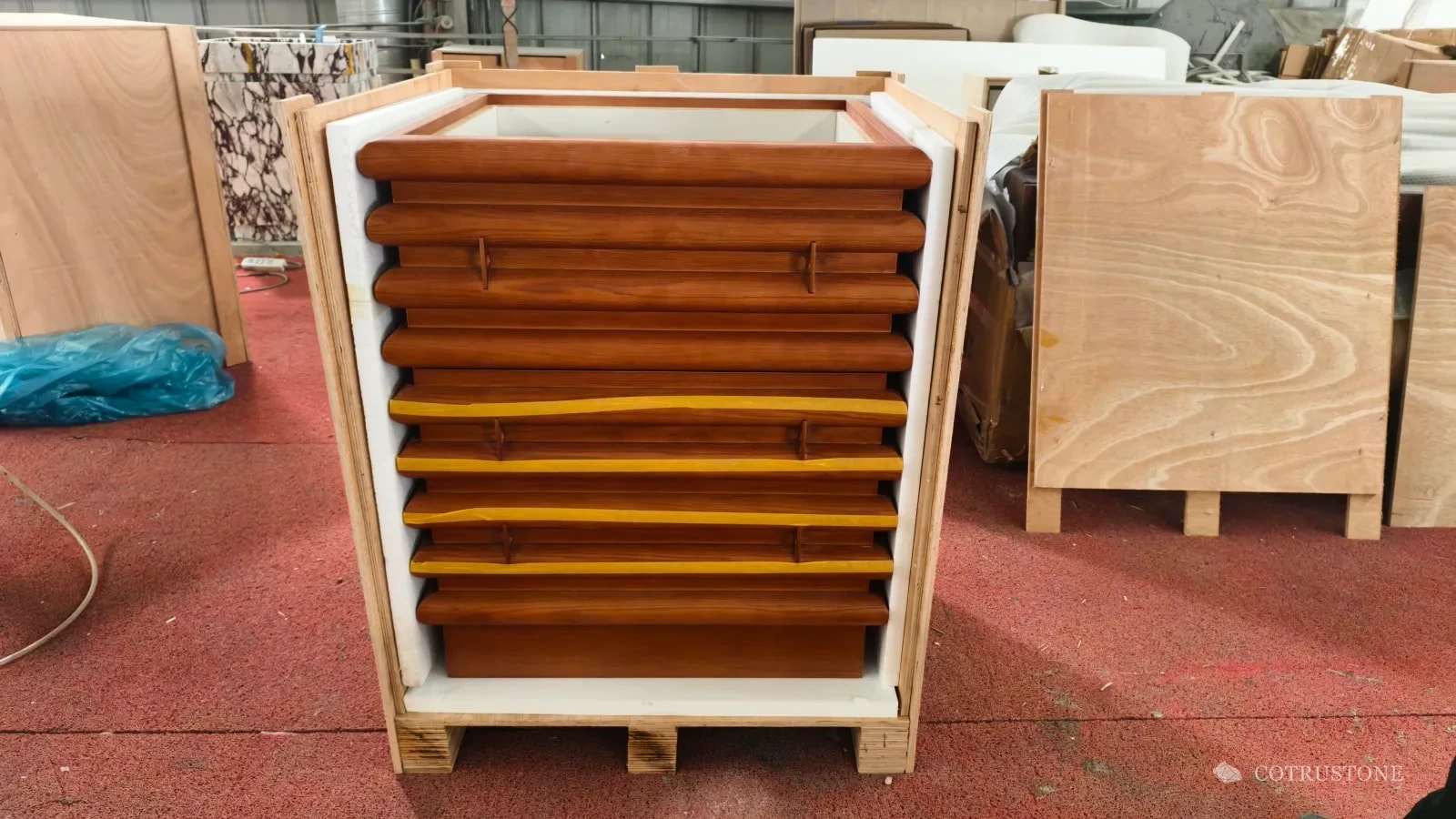 Wooden cabinet body inside an open lined timber shipping case