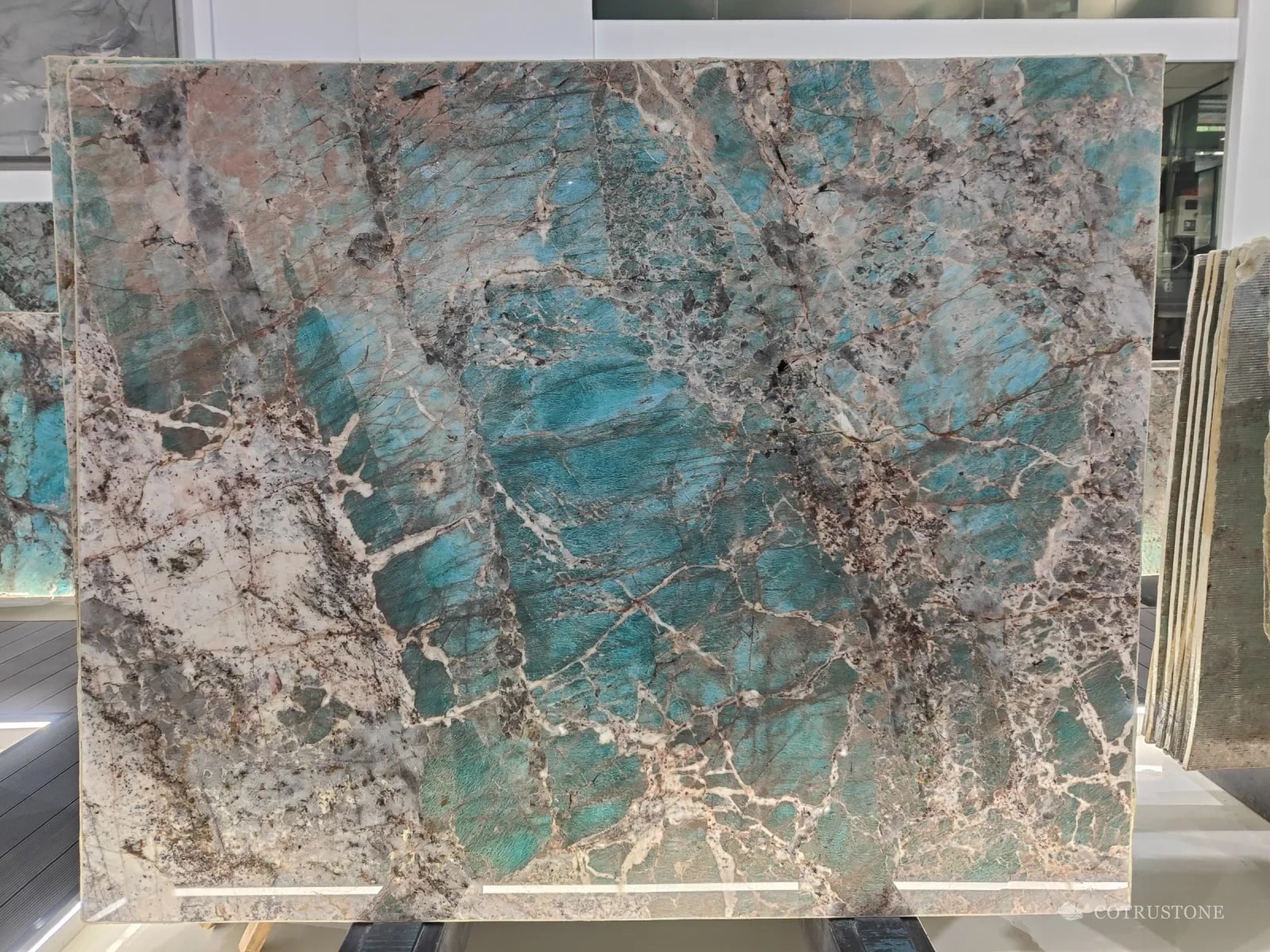 A full slab of Amazonite quartzite, turquoise with rose and grey