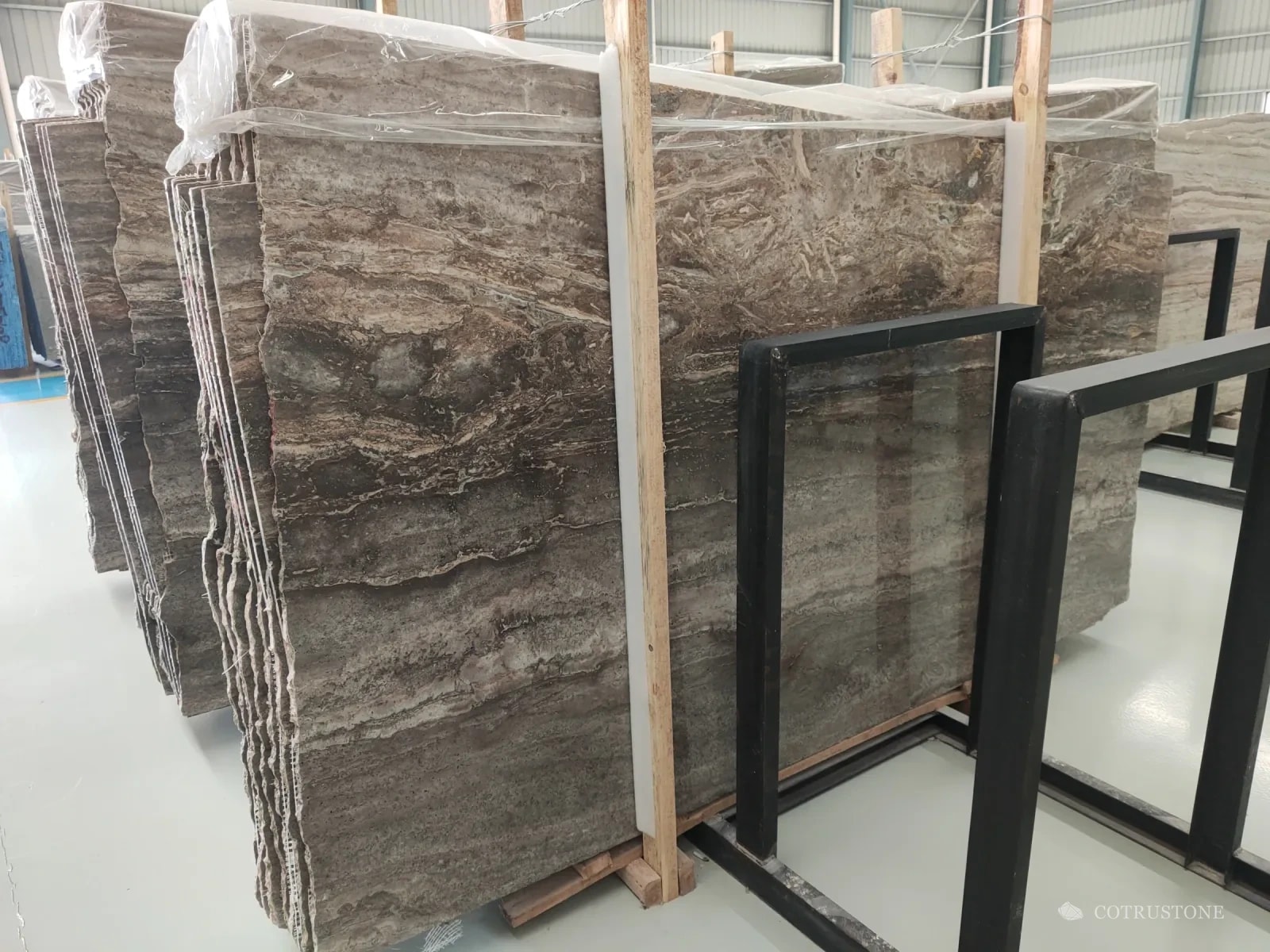 Slabs of Iranian Silver travertine on the rack