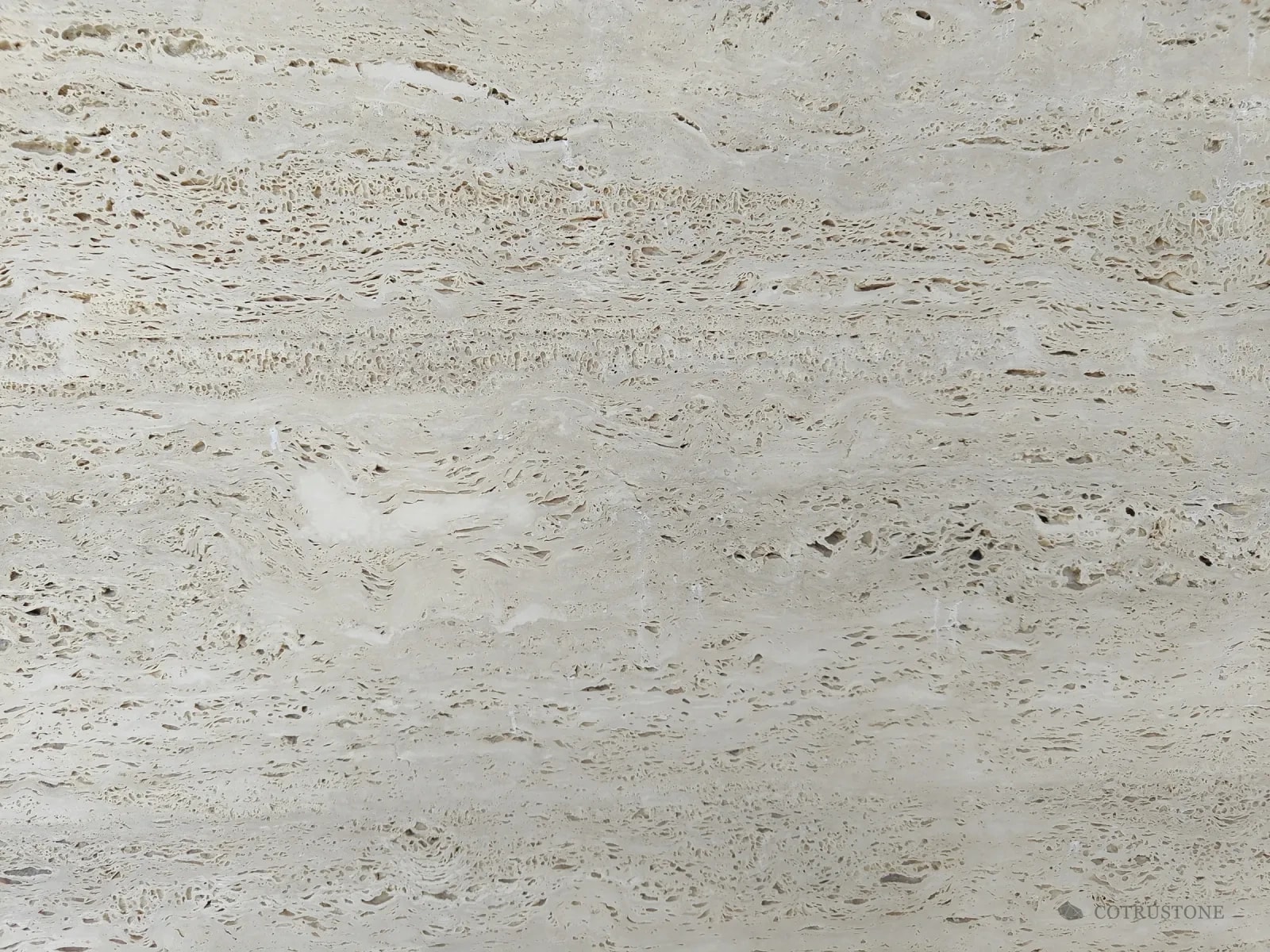 Close view of Italian Ivory travertine with open pores