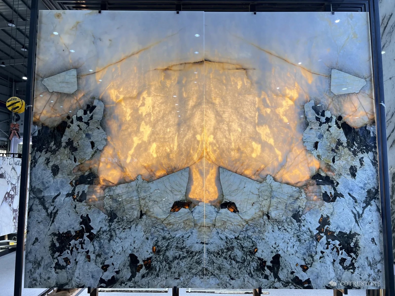 A Patagonia slab lit from behind, glowing amber through the white