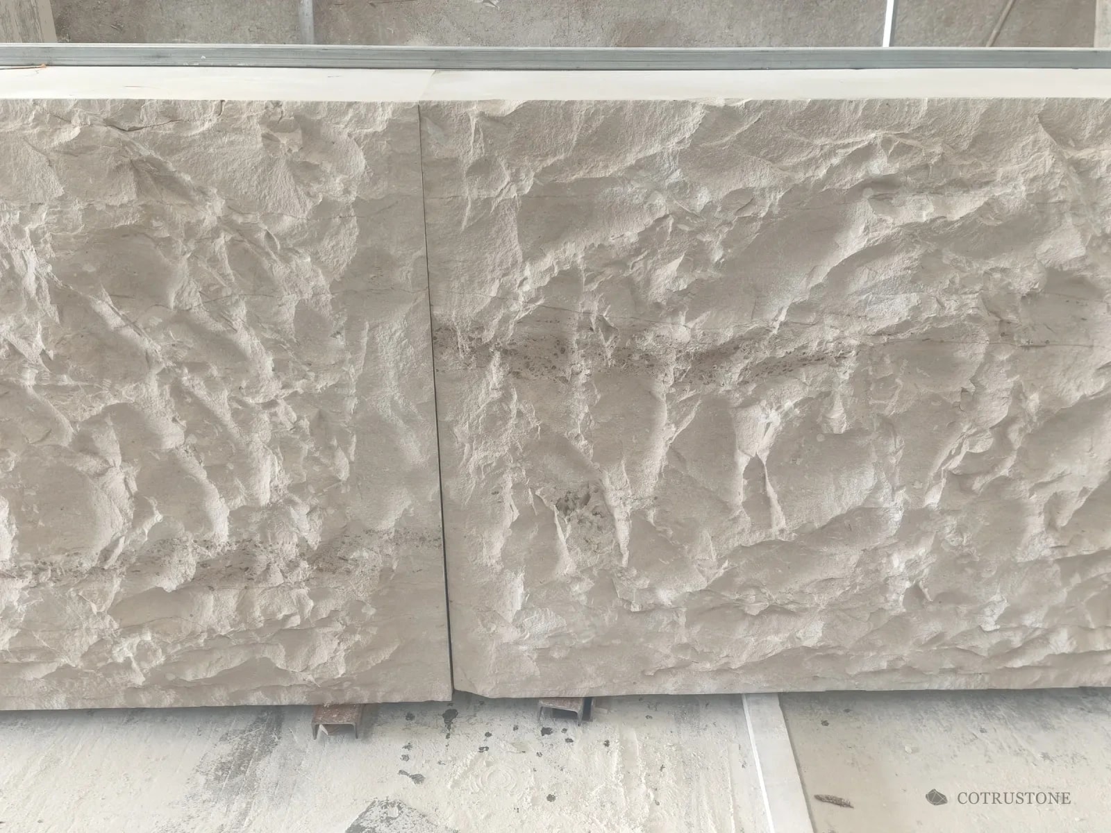 Portuguese Beige limestone with a hand-cut textured face