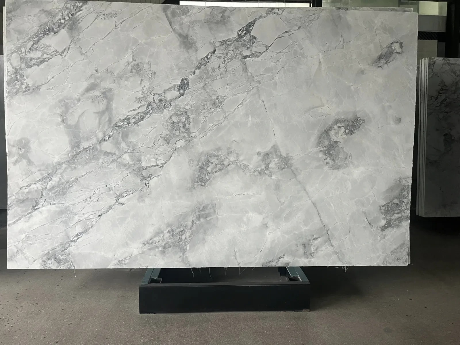 A full slab of Super White, white with soft grey veining
