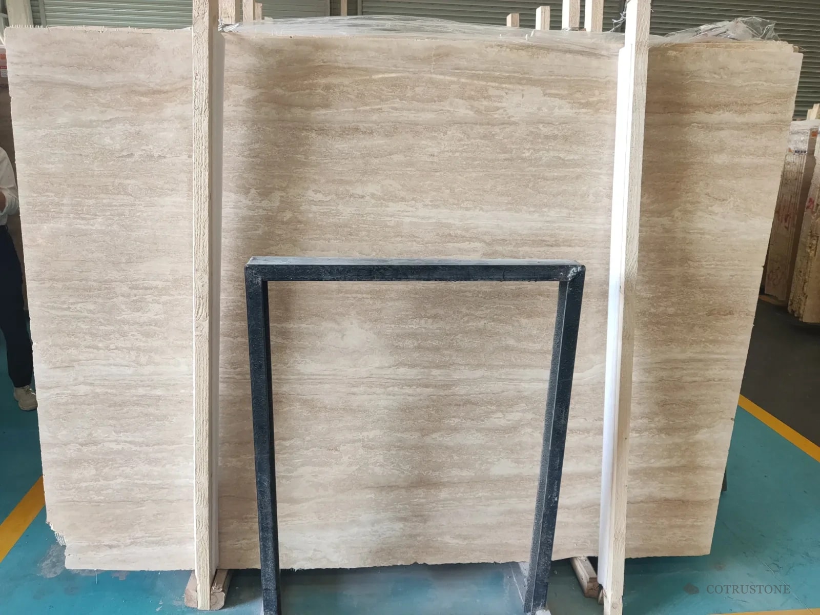 A slab of warm beige travertine in straight bands