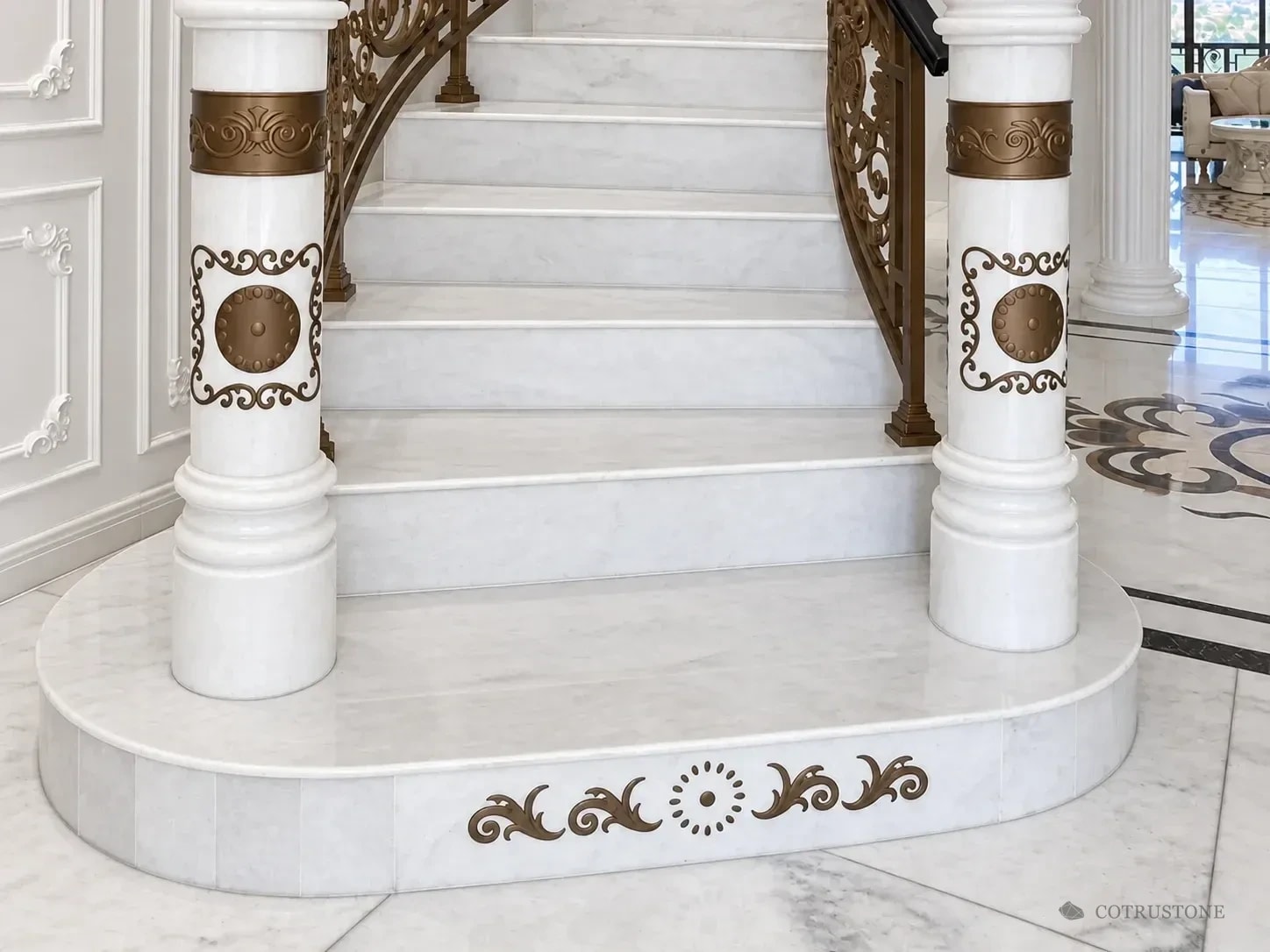 White marble stair treads, profiled nosings and curved starting step with stone newel posts