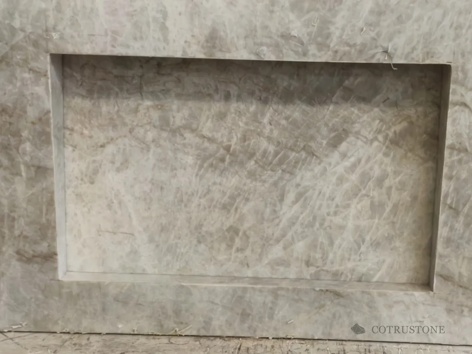 Taj Mahal stone grain around a fabricated recessed bowl and edge
