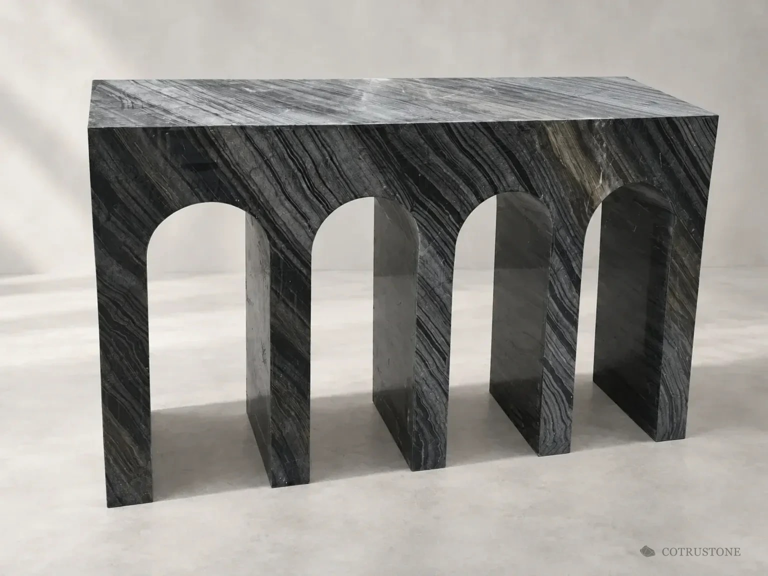 Three-arch dark veined stone console on a neutral studio background