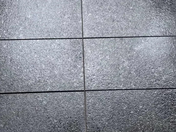 Angola Black Granite Tiles — dark grey to black granular appearance