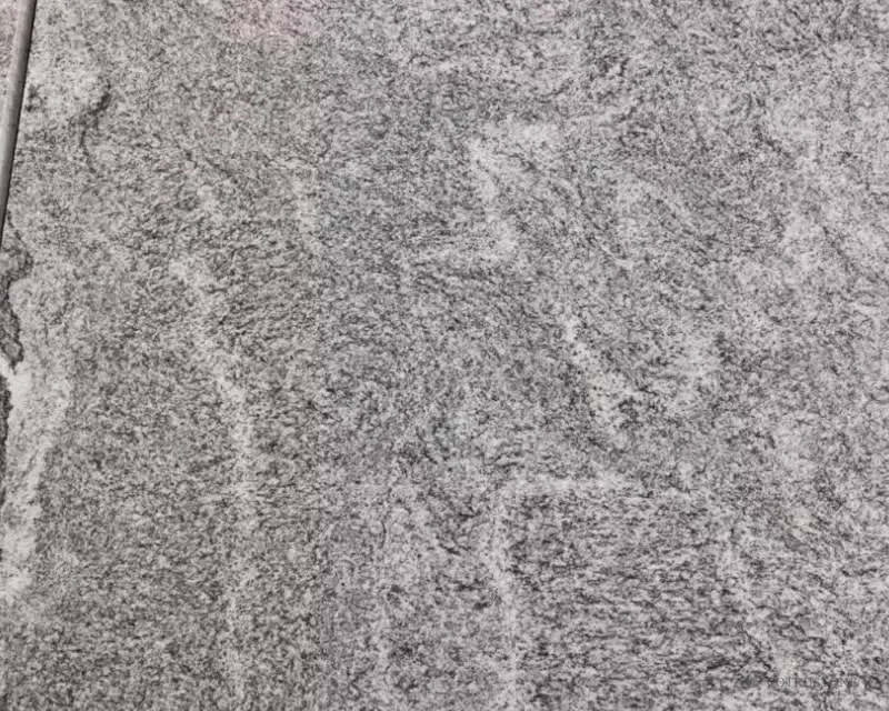 Ash Grey Granite Tiles — grey granular surface