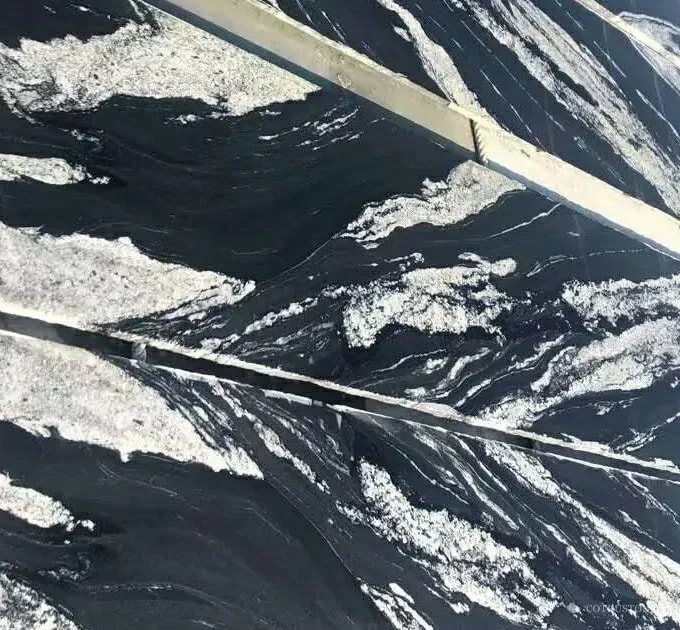 Royal Ballet Granite Tile — dark ground with bold light movement
