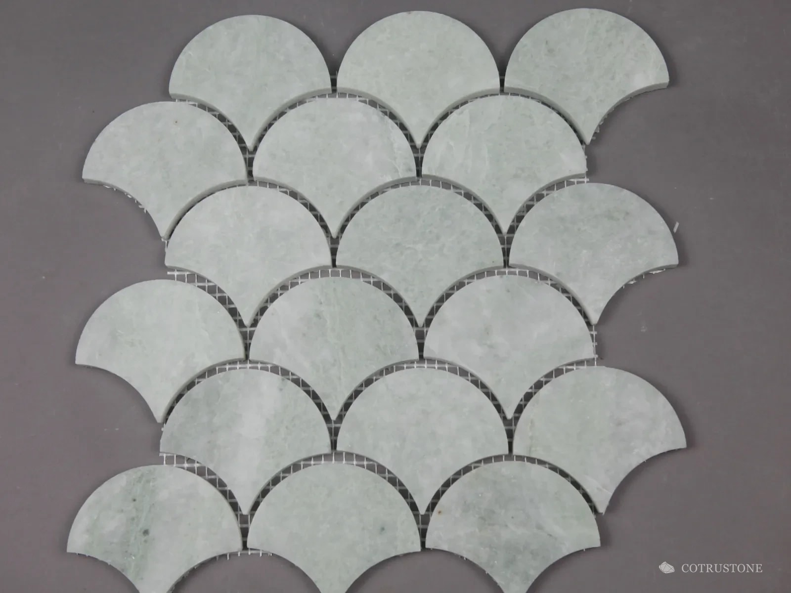 Fan-shaped mosaic sheet in pale green stone
