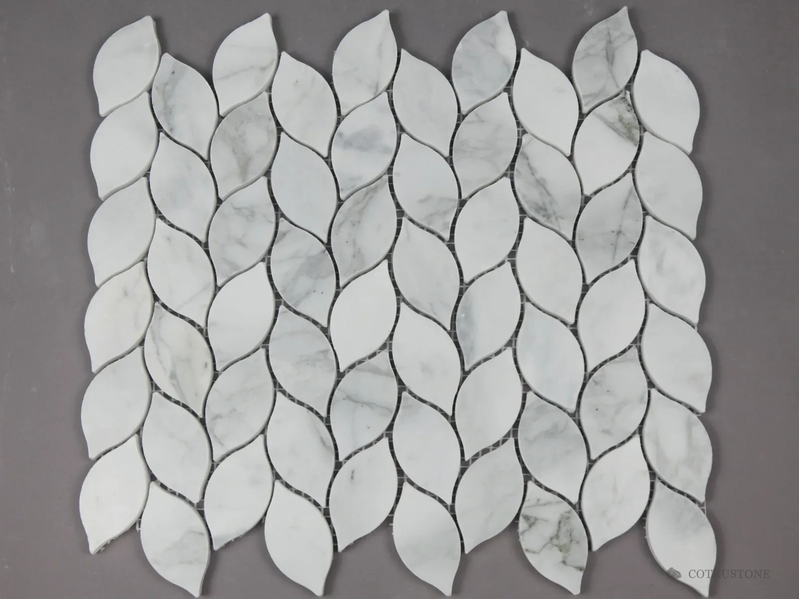Leaf-shaped mosaic sheet in white stone with grey veins