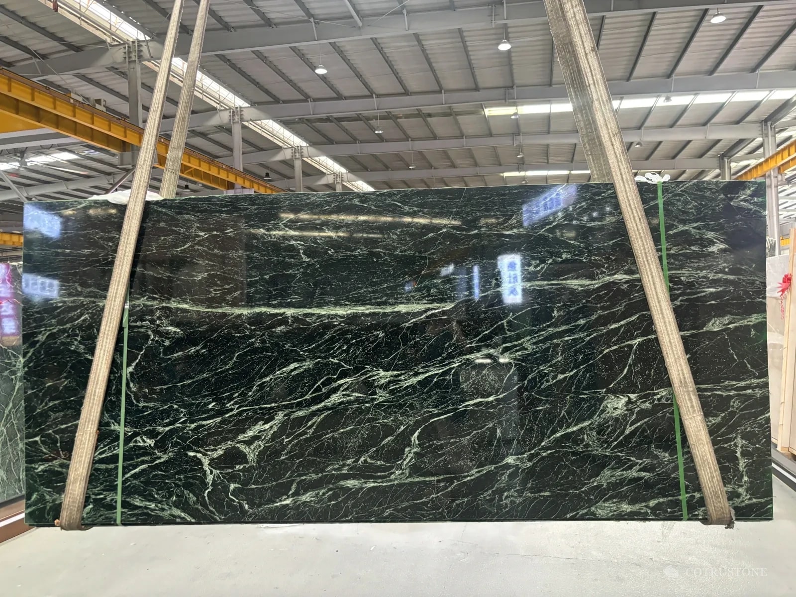 A full slab of Prada green marble with white veins