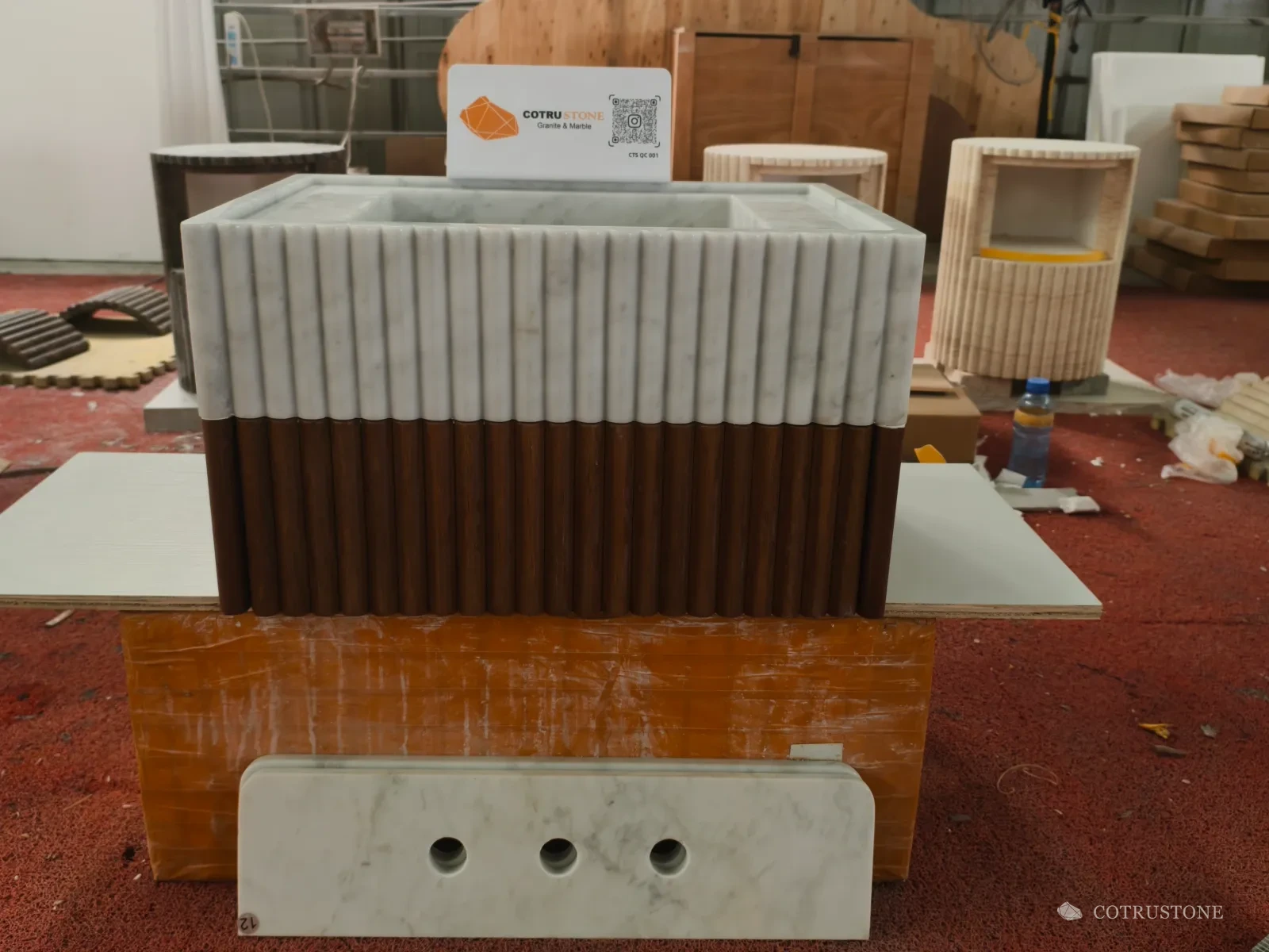 White stone and timber vanity photographed during preparation